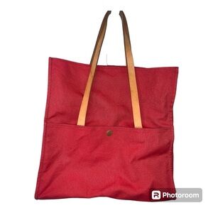 Kate Spade New York Saturday Convertible tote bag with leather straps.